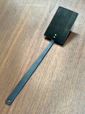 close up of carbon steel BBQ spatula with 11' handle and copper rivets